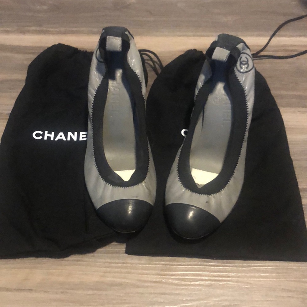 Grey and black authentic Chanel slip on heels.